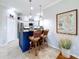 Charming kitchen island with seating complemented by stainless appliances and decor at 5663 Sunset Falls Dr, Apollo Beach, FL 33572