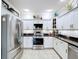 Efficient kitchen design featuring stainless appliances, sleek countertops, and ample cabinetry at 5663 Sunset Falls Dr, Apollo Beach, FL 33572