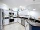 Stylish kitchen with stainless appliances, ample counter space, and seating at 5663 Sunset Falls Dr, Apollo Beach, FL 33572