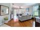 Comfortable living room with neutral colors, hardwood floors, and sliding glass doors at 5663 Sunset Falls Dr, Apollo Beach, FL 33572