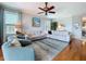 Bright and airy living room features hardwood floors, neutral tones, and ample seating at 5663 Sunset Falls Dr, Apollo Beach, FL 33572