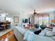 Cozy living room with hardwood floors, comfortable seating, and sliding glass doors at 5663 Sunset Falls Dr, Apollo Beach, FL 33572