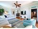 Inviting living room boasts an open floor plan, hardwood floors, and stylish decor at 5663 Sunset Falls Dr, Apollo Beach, FL 33572