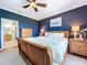 Comfortable main bedroom featuring wood floors, ensuite bathroom, and furnishings at 5663 Sunset Falls Dr, Apollo Beach, FL 33572