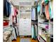 Organized walk-in closet with built-in shelving and ample storage space at 5663 Sunset Falls Dr, Apollo Beach, FL 33572