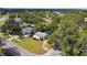 Corner lot home featuring a manicured lawn and mature trees at 5906 12Th St, Zephyrhills, FL 33542