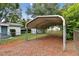 View of metal carport in back yard at 5906 12Th St, Zephyrhills, FL 33542