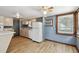 Functional kitchen with light-colored cabinets, appliances, and wood-look flooring at 5906 12Th St, Zephyrhills, FL 33542