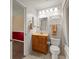 Well-lit bathroom with vanity, mirror, and combination tub and shower with curtain at 6114 Oak Cluster Cir, Tampa, FL 33634
