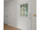 Bright entryway featuring a door with window and a view of the outside at 6114 Oak Cluster Cir, Tampa, FL 33634