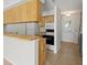 Kitchen with wood cabinets, breakfast bar, and black appliances at 6114 Oak Cluster Cir, Tampa, FL 33634