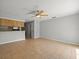 Open living area with tile flooring that flows seamlessly into the kitchen at 6114 Oak Cluster Cir, Tampa, FL 33634