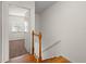 Bright entryway staircase with hardwood steps and white walls leading to the upper level at 6114 Oak Cluster Cir, Tampa, FL 33634