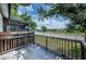 Enjoy outdoor living on the spacious back deck with wood railing and serene neighborhood view at 6206 92Nd N Pl # 3605, Pinellas Park, FL 33782