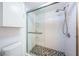 Bathroom featuring glass enclosed shower with modern fixtures and mosaic tile flooring at 6206 92Nd N Pl # 3605, Pinellas Park, FL 33782