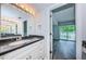 Tastefully updated bathroom features modern vanity, marble countertops, and a stylish mirror at 6206 92Nd N Pl # 3605, Pinellas Park, FL 33782