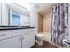 Bathroom with vanity, toilet, mirror, and shower/tub combo behind patterned shower curtain at 6206 92Nd N Pl # 3605, Pinellas Park, FL 33782