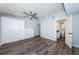 Bright bedroom features new flooring, a ceiling fan, and ensuite bath access at 6206 92Nd N Pl # 3605, Pinellas Park, FL 33782