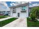 Inviting townhome featuring a private balcony, garage, and well-maintained landscaping at 6206 92Nd N Pl # 3605, Pinellas Park, FL 33782
