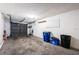 Spacious garage with concrete floor, overhead door, pegboard, and storage space at 6206 92Nd N Pl # 3605, Pinellas Park, FL 33782