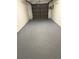 Spacious garage with epoxy floor provides ample storage and parking at 6206 92Nd N Pl # 3605, Pinellas Park, FL 33782