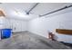 Spacious garage featuring concrete flooring, a garage door opener, and ample room for storage at 6206 92Nd N Pl # 3605, Pinellas Park, FL 33782