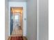 Hallway view showcasing the front door, neutral walls, and a glimpse of the stairs at 6206 92Nd N Pl # 3605, Pinellas Park, FL 33782
