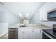 Bright kitchen area with bar seating, granite countertops and views of the adjacent living space at 6206 92Nd N Pl # 3605, Pinellas Park, FL 33782