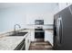 Well-lit kitchen featuring stainless steel appliances, ample counter space, and stylish cabinetry at 6206 92Nd N Pl # 3605, Pinellas Park, FL 33782