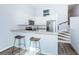 Modern kitchen featuring white cabinets, stainless steel appliances, and a breakfast bar at 6206 92Nd N Pl # 3605, Pinellas Park, FL 33782