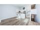 Open-concept living space showcasing hardwood floors, a breakfast bar, and a staircase at 6206 92Nd N Pl # 3605, Pinellas Park, FL 33782
