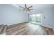 Open living area featuring ceiling fan, sliding doors to the balcony, and modern flooring at 6206 92Nd N Pl # 3605, Pinellas Park, FL 33782
