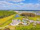 Aerial shot featuring a community pool, playground, and lush greenery, great for families at 7024 Bradbury Cir, Wesley Chapel, FL 33545
