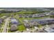 Aerial view of homes next to a pond, showcasing a Gathering-friendly neighborhood at 7024 Bradbury Cir, Wesley Chapel, FL 33545