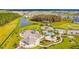 Beautiful aerial view of the community amenities including a pool, playground, and picnic area at 7024 Bradbury Cir, Wesley Chapel, FL 33545