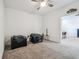 Carpeted bonus room with minimal furnishing, offering versatile space for various activities at 7024 Bradbury Cir, Wesley Chapel, FL 33545