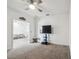 Additional bonus room featuring carpet, a television, and minimal furnishings, offering versatile space at 7024 Bradbury Cir, Wesley Chapel, FL 33545