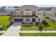 Charming two-story home with manicured lawn and a welcoming front porch at 7024 Bradbury Cir, Wesley Chapel, FL 33545