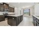 Spacious kitchen with large center island, stainless steel appliances, and ample countertop space at 7024 Bradbury Cir, Wesley Chapel, FL 33545