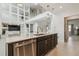 Close up of kitchen island with stainless steel dishwasher and second story view at 7024 Bradbury Cir, Wesley Chapel, FL 33545