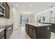 Beautiful kitchen featuring an island, pendant lights, and stainless steel appliances at 7024 Bradbury Cir, Wesley Chapel, FL 33545