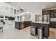 Large, modern kitchen with a center island, stainless steel appliances, and access to the living areas at 7024 Bradbury Cir, Wesley Chapel, FL 33545