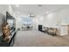 Spacious loft area with carpet, recessed lighting, and ample seating; perfect for entertaining or relaxing at 7024 Bradbury Cir, Wesley Chapel, FL 33545