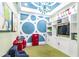 Bright playroom with custom built-ins, a chalkboard wall, and fun decorations at 7024 Bradbury Cir, Wesley Chapel, FL 33545