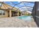 Screened pool overlooks the yard at 7024 Bradbury Cir, Wesley Chapel, FL 33545