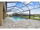 Screened pool overlooks the lake at 7024 Bradbury Cir, Wesley Chapel, FL 33545