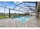 Screened pool overlooks the lake at 7024 Bradbury Cir, Wesley Chapel, FL 33545