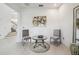 Cozy sitting area featuring neutral walls, tile floors, and glass top table at 7024 Bradbury Cir, Wesley Chapel, FL 33545