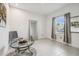 Cozy sitting area featuring neutral walls, tile floors, and glass top table at 7024 Bradbury Cir, Wesley Chapel, FL 33545