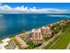 Beautiful aerial view showing a community by the water with dock, pool and well-manicured landscaping at 7430 Sunshine Skyway S Ln # 602, St Petersburg, FL 33711